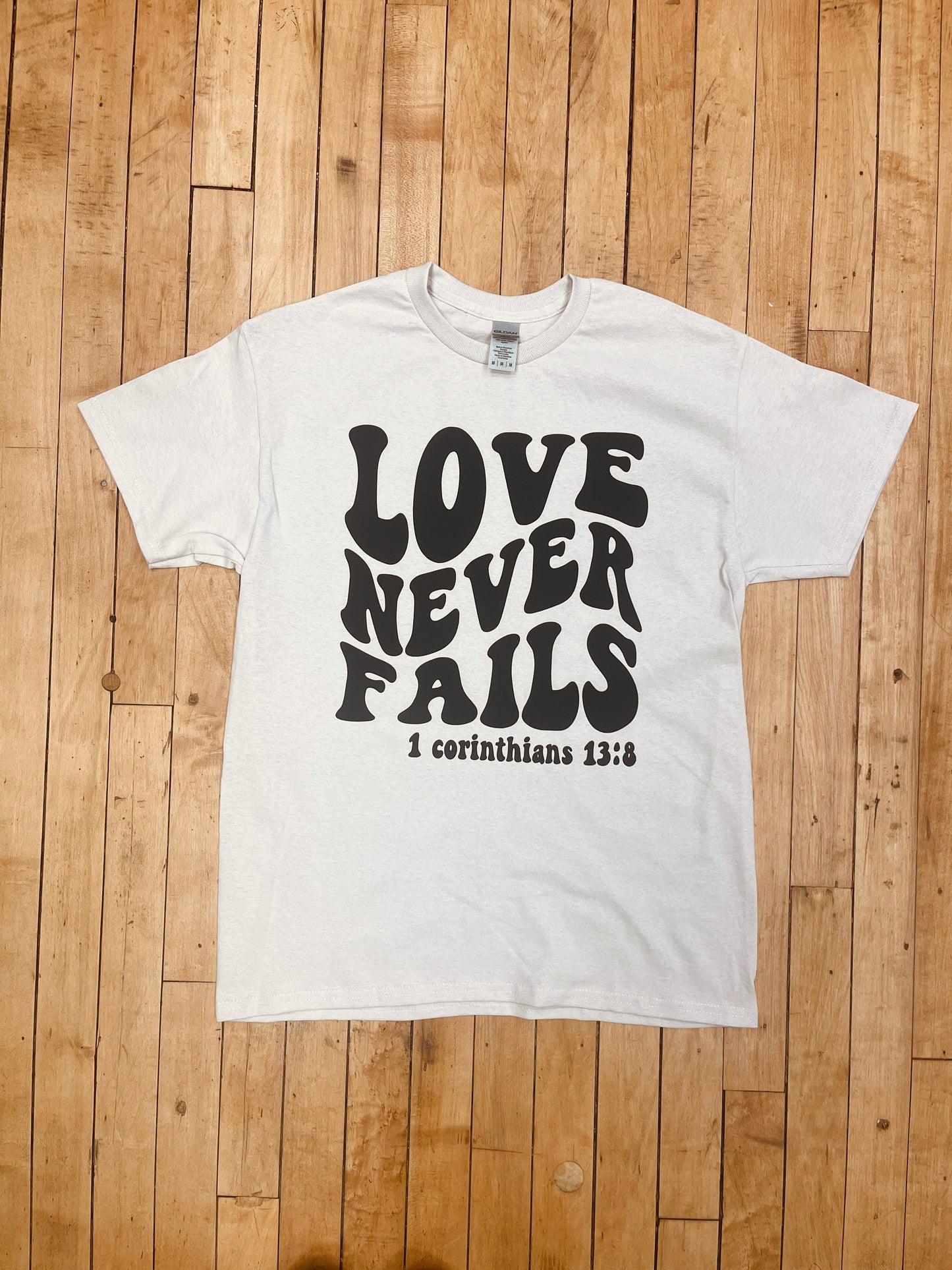 Love Never Fails Tee